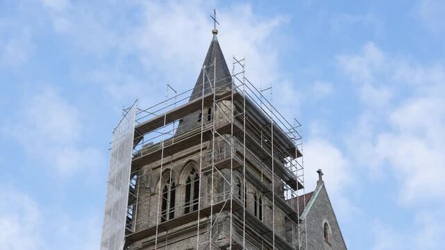 Renovation of a church bell tower. With scaffolding.