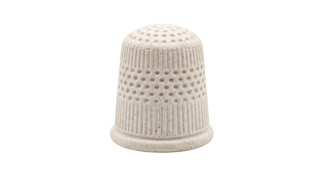 Vintage ceramic thimble with dimpled texture and ribbed sides