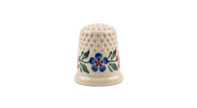 Hand-painted ceramic thimble with floral design and dimpled texture