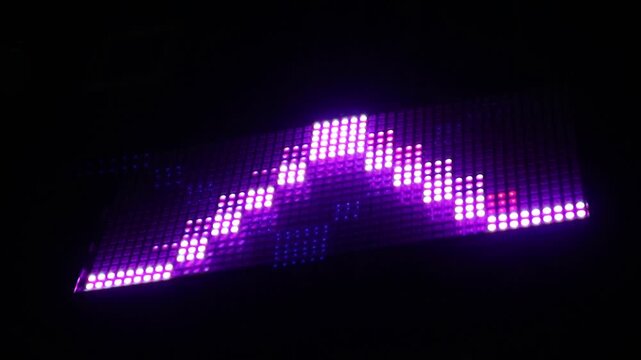 Abstract purple light pattern displayed on a digital LED matrix screen.