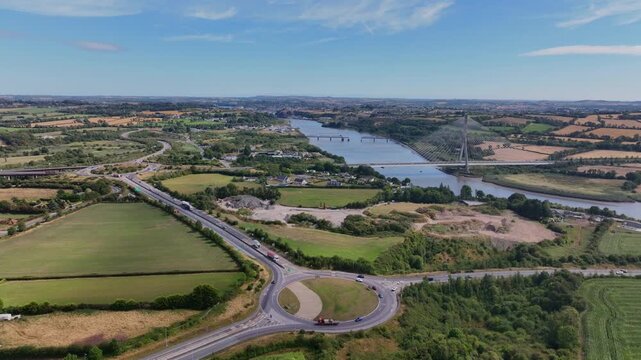 Amazing aerials Ireland infrastructure exit from the M9 from Dublin road system to Waterford City Thomas Francis Meagher Bridge over the River Suir