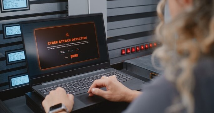 Female IT Specialist Responds to Cyber Attack Alert Using Linux Command Line, Reviewing Server Telemetry and Performing Emergency Recovery Steps During Critical Infrastructure Security Incident.
