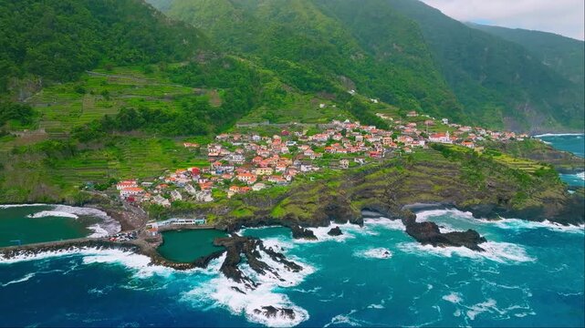 Aerial drone shot of Seixal village on Atlantic Ocean coast on Madeira Island, Portugal