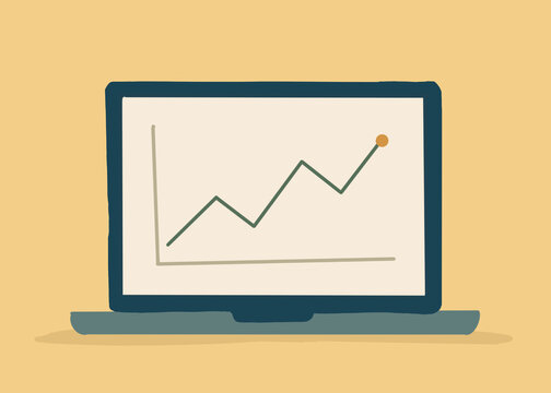 A laptop screen displays a rising financial growth chart