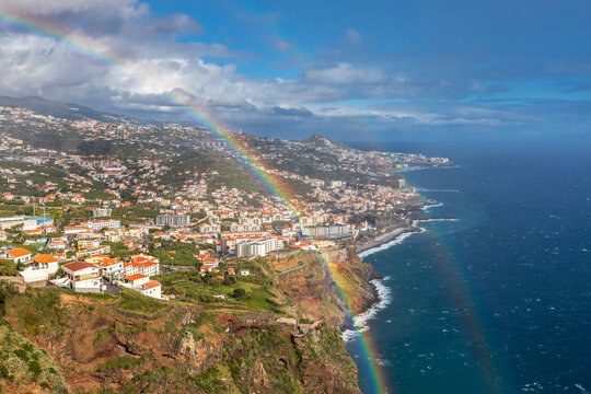Rainbow over Camara de Lobos coastal village Madeira Portugal