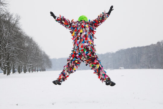Germany, Cologne, Senior man in traditional costume jumping