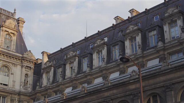 Ornate rooftop windows on Paris City Hall facade
