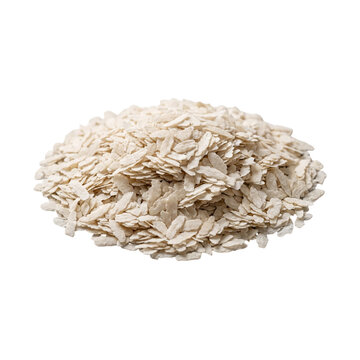 Flattened rice flakes gathered into a dense pile showcasing their pale texture and dry appearance.