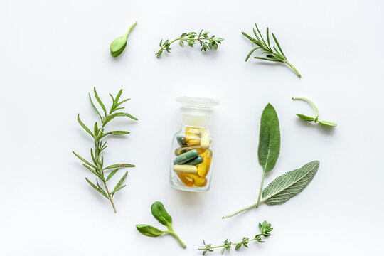 Herbal formulations for health care on white background top view pattern