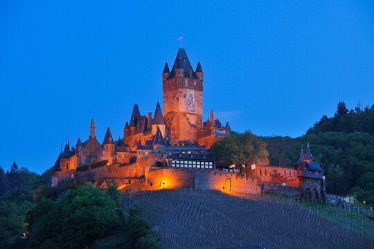 Germany, Rhineland-Palatinate, Cochem, Moselle, View of illuminated of Cochem castle at dusk