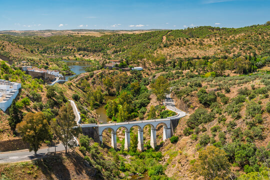 The Ponte de M�rtola viaduct crosses a river in a Portuguese valley