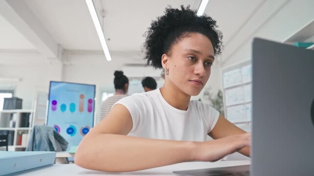 Brazilian Female business working on a laptop at office