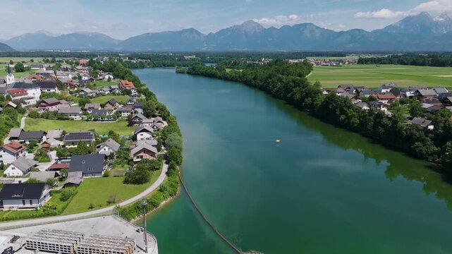 Rooftop solar panels on hydropower plant generate clean energy from water and sun. This setup supports low carbon electricity supply.
