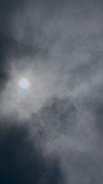 Sun Shining Through Dark Clouds in Gray Sky