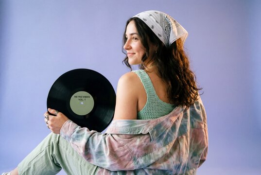 Woman with Detailed Vinyl Record Label and Tie-Dye Shirt on Lavender