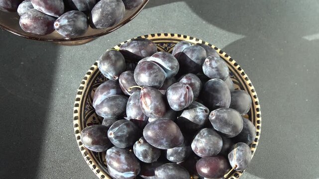 Blue Plums Food Background. Plum harvest in bowl.
