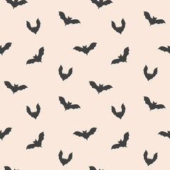 Fototapeta premium Halloween seamless pattern with bats on a beige background, hand drawn