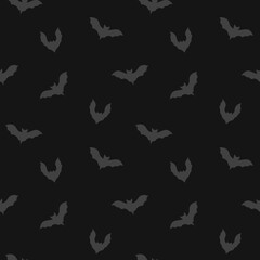 Fototapeta premium Halloween seamless pattern with bats on a dark gray background, hand drawn