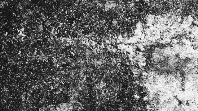 High contrast black and white grunge wall texture with distressed patches and rugged surface, ideal for backgrounds, wallpapers, posters, and industrial design.