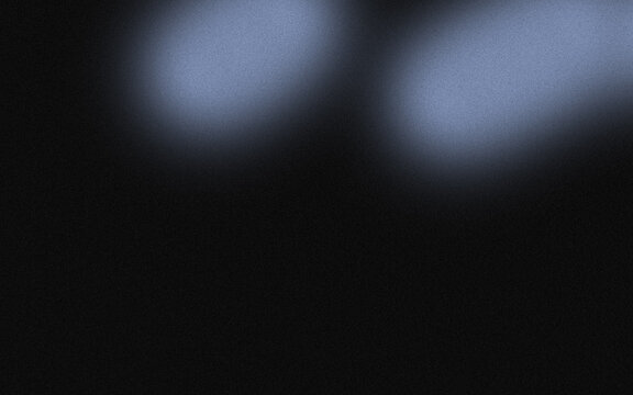 Abstract blurred light shapes on dark background