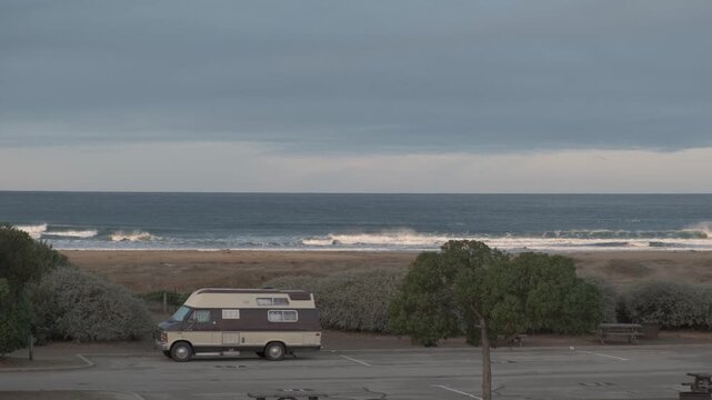 View of Vintage Oldschool RV Parked at Morro Strand State Beach Morning 4K