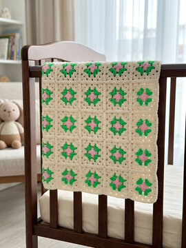 Crochet granny square blanket draped on modern armchair, cozy handmade interior home decor