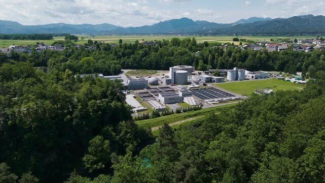 This facility features settling tanks and filtration systems for water recycling and supports municipal services in a suburban setting.