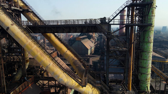Factory, industrial enterprise, metallurgical plant, smoke from chimneys, aerial photography from a drone.