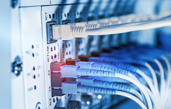 Fiber Optic cables connected to optic ports and UTP, Network cables connected to ethernet ports