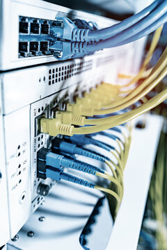 Fiber Optic cables connected to optic ports and UTP, Network cables connected to ethernet ports