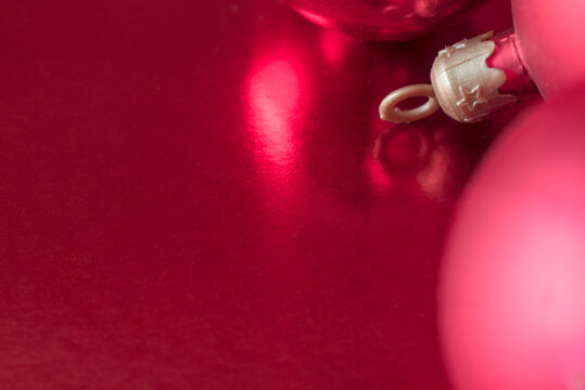 Festive Christmas baubles on red background with cap.