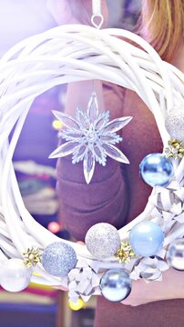 Beautiful wreath decoration with baubles and glass star in middle