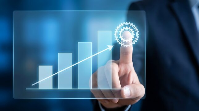 Business person touching a transparent digital screen displaying a growing bar chart with a gear representing industrial growth and success