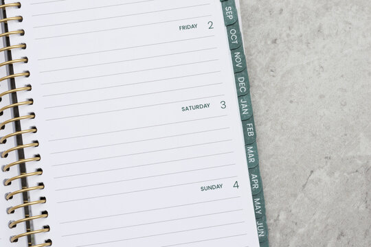 Daily planner on marble stone for time management and scheduling
