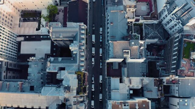 Aerial view of a busy street in Paris with historic buildings and traffic in Paris, Ile-de-France, France.