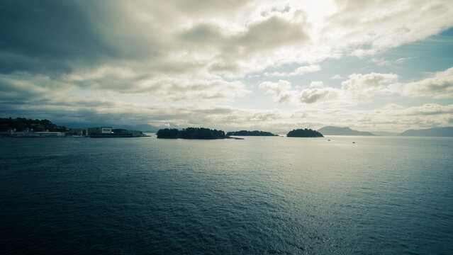 Breathtaking skyscape meets waters and islands off Leirvik, Norway