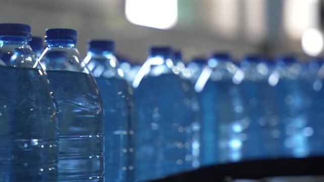 Rows of Bottled Water in Plastic Bottles at Factory