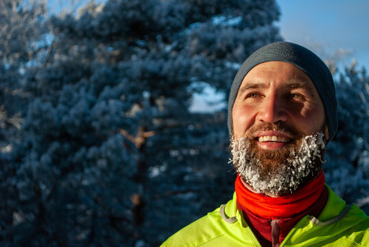 Joyful winter athlete feeling runner's high after outdoor exercise in the cold