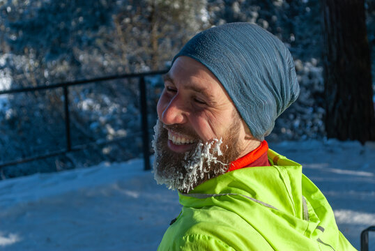 Smiling runner enjoying post workout happiness after a frosty winter run