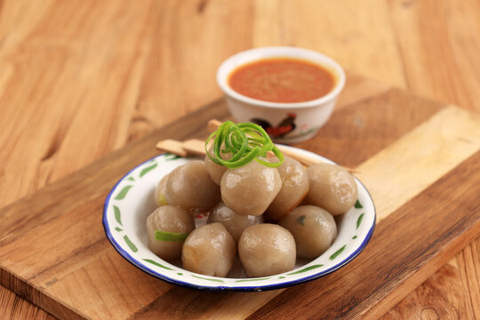 Cilok, Boiled Tapioca Chewy Balls Served with Bumbu Kacang or Peanut Sauce.
