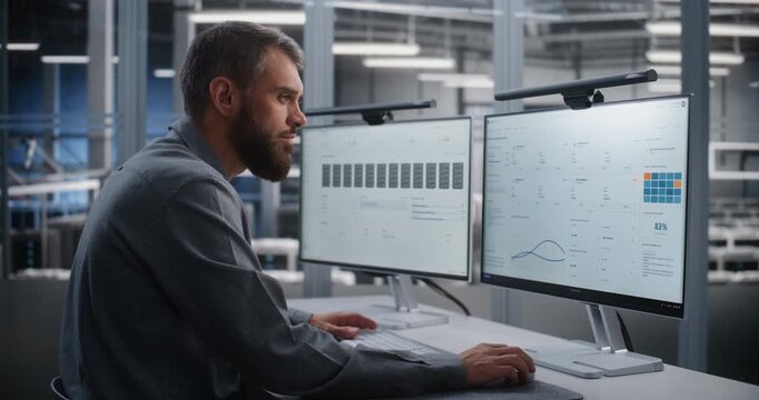 Engineer Working inside Control Office Detects Cyber Attack While Overseeing Vast Server Facility, Then Takes Immediate Corrective Action to Safeguard Infrastructure, Services, and Operations.