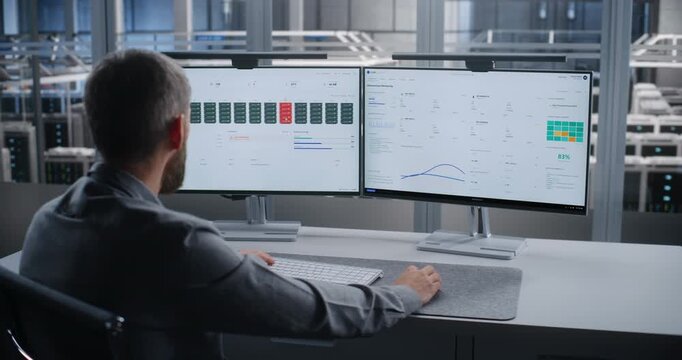 IT Specialist Monitors Server Infrastructure Across Dual Screens After Critical Overheating Alert, Troubleshooting Data Center Systems to Prevent Equipment Damage, Downtime, and Service Disruption.
