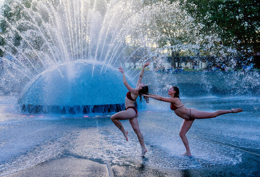 White women performing acrobatic dance moves