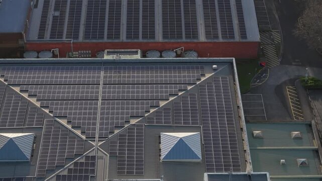 Melbourne, VIC, Australia - 03 September 2026: Aerial view of solar panels installed on the roof of the Knox Data Centre with skylights and surrounding parking area.