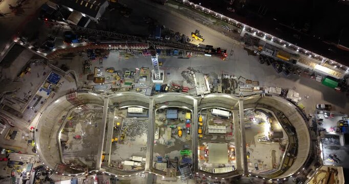 London, England - 21 March 2026: Aerial view of the HS2 Victoria Road Crossover Box construction site at night, featuring illuminated excavation zones and cranes.