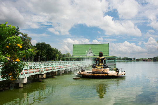 View landscape large freshwater lake swamp and Statue of Phaya Chalawan in human form for thai people traveler travel visit in garden at Bueng Si Fai public park on August 2, 2026 in Phichit, Thailand
