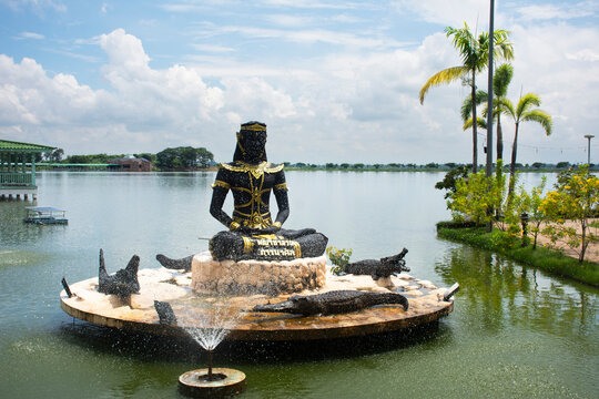 View landscape large freshwater lake swamp and Statue of Phaya Chalawan in human form for thai people traveler travel visit in garden at Bueng Si Fai public park on August 2, 2026 in Phichit, Thailand