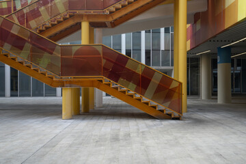 Obraz premium colorful glass staircase in modern building interior