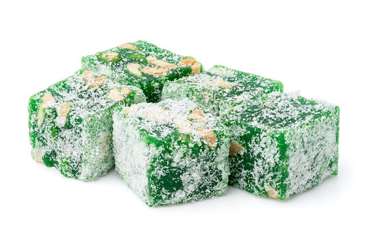 Assorted Turkish delight sweets pattern background. Colorful Rahat lokum with nuts and coconut flakes close up. Dessert	
