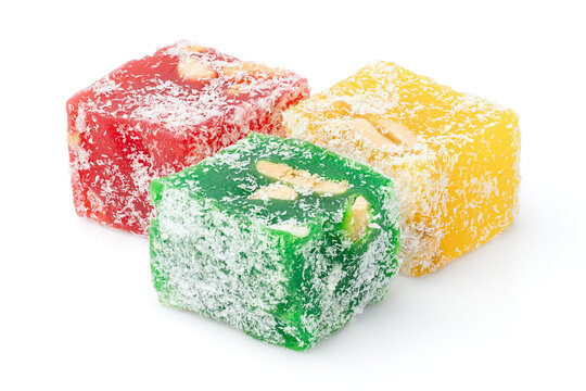 Assorted Turkish delight sweets pattern background. Colorful Rahat lokum with nuts and coconut flakes close up. Dessert	
